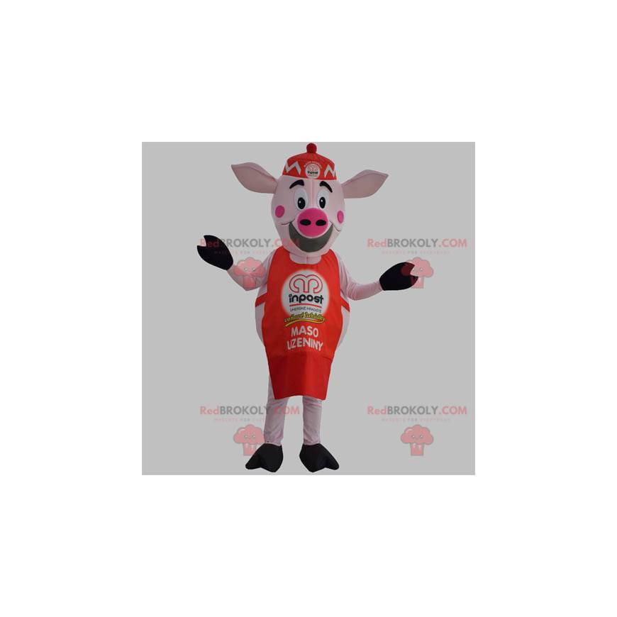 Mascota de cerdo rosa con delantal rojo y gorra. -