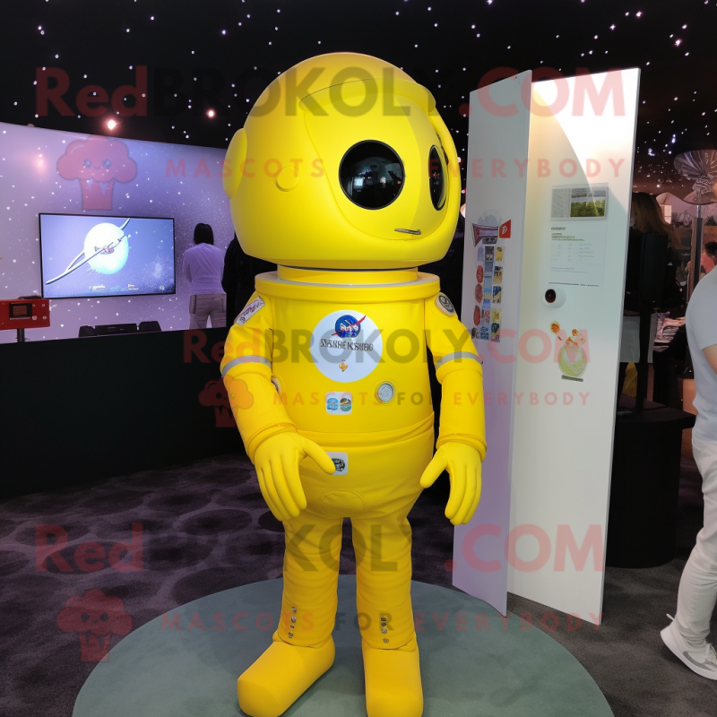 Lemon Yellow Astronaut mascot costume character dressed with a Cover-up and Lapel pins Lemon Yellow Astronaut mascot costume character dressed with a Cover-up and Lapel pins