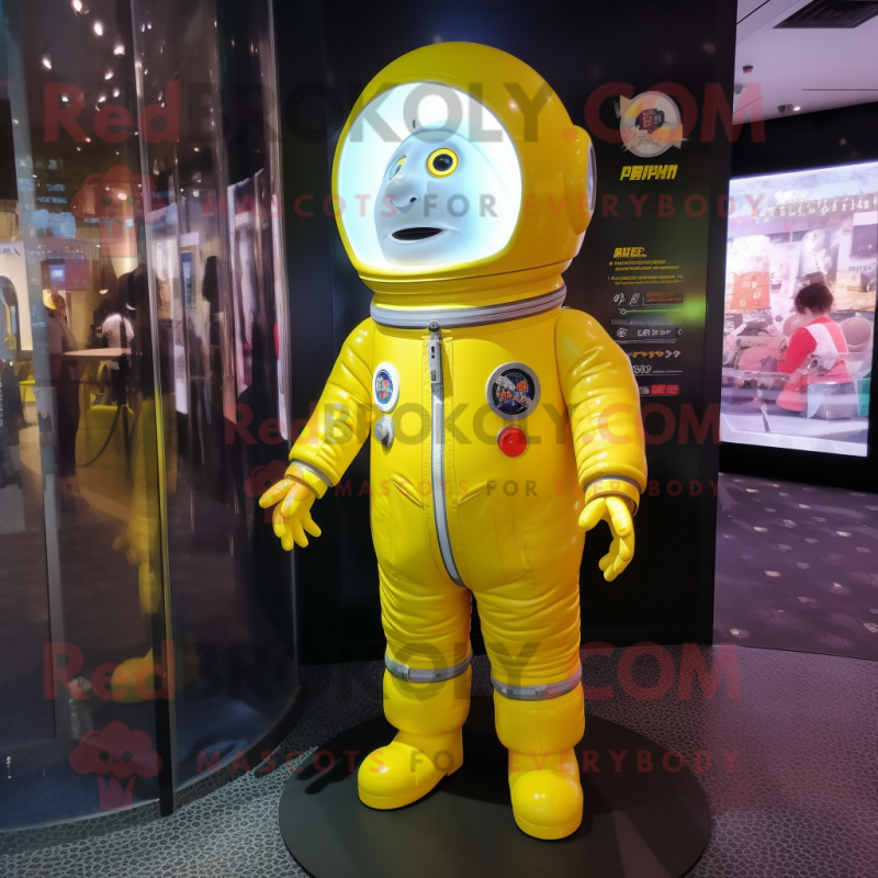 Lemon Yellow Astronaut mascot costume character dressed with a Cover-up and Lapel pins Lemon Yellow Astronaut mascot costume character dressed with a Cover-up and Lapel pins