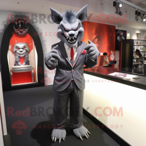 Gray Devil mascot costume character dressed with a Suit Jacket and Bracelet watches