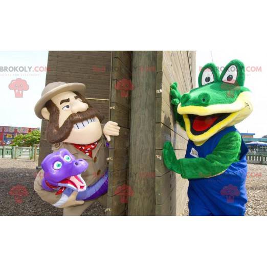 2 mascottes un crocodile vert et un explorateur tenant un