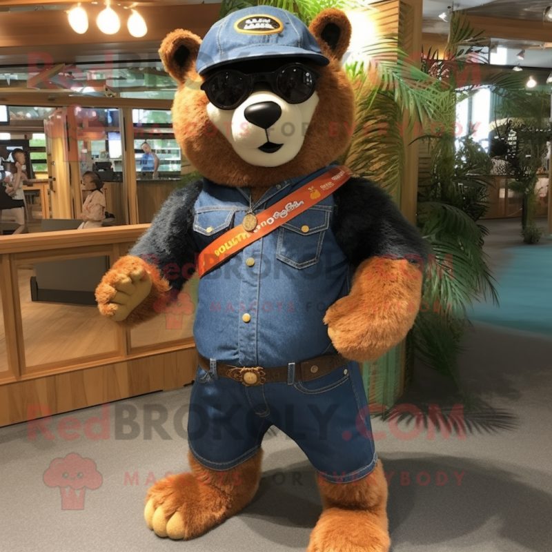 Orange Spectacled Bear mascot costume character dressed with a Denim Shorts and Rings Orange Spectacled Bear mascot costume character dressed with a Denim Shorts and Rings