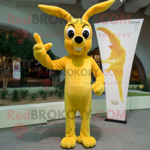 Lemon Yellow Gazelle mascot costume character dressed with a Flare Jeans and Mittens