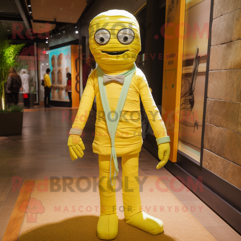 Lemon Yellow Mummy mascot costume character dressed with a Boyfriend Jeans and Bow ties