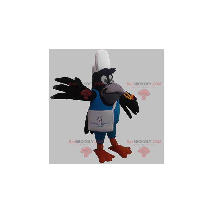 Zwarte vogel kraai ekster mascotte in leveringsuitrusting -