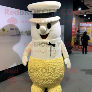 Cream Pop Corn mascot costume character dressed with a Dress Shirt and Caps