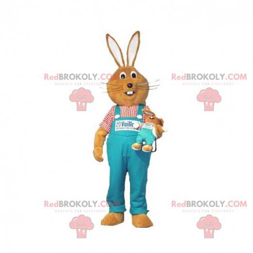 Mascotte de lapin marron avec une salopette bleue -