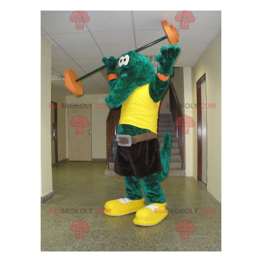 Mascota de cocodrilo verde con una camiseta amarilla -