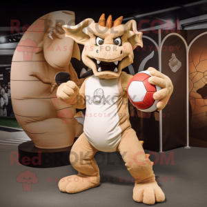 Tan Dragon mascot costume character dressed with a Rugby Shirt and Rings