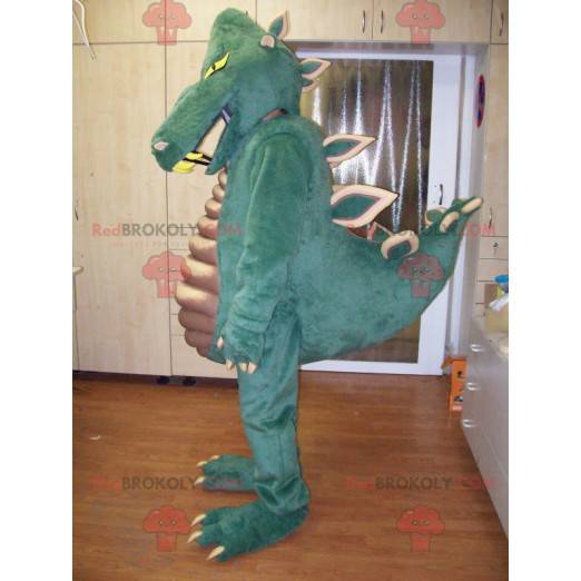 Mascote de dinossauro verde muito impressionante e bem-sucedido