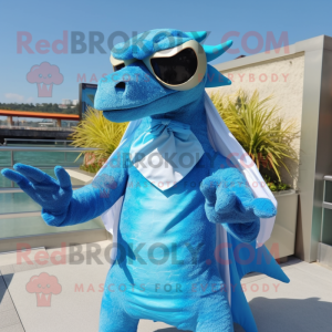 Sky Blue Spinosaurus mascot costume character dressed with a Cover-up and Sunglasses