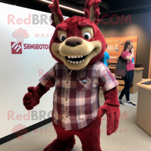 Maroon Chupacabra mascot costume character dressed with a Flannel Shirt and Smartwatches