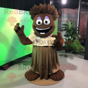 Brown Frankenstein'S Monster mascot costume character dressed with a Maxi Skirt and Lapel pins