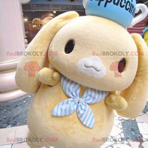 Mascot little yellow rabbit with a teapot on his head -