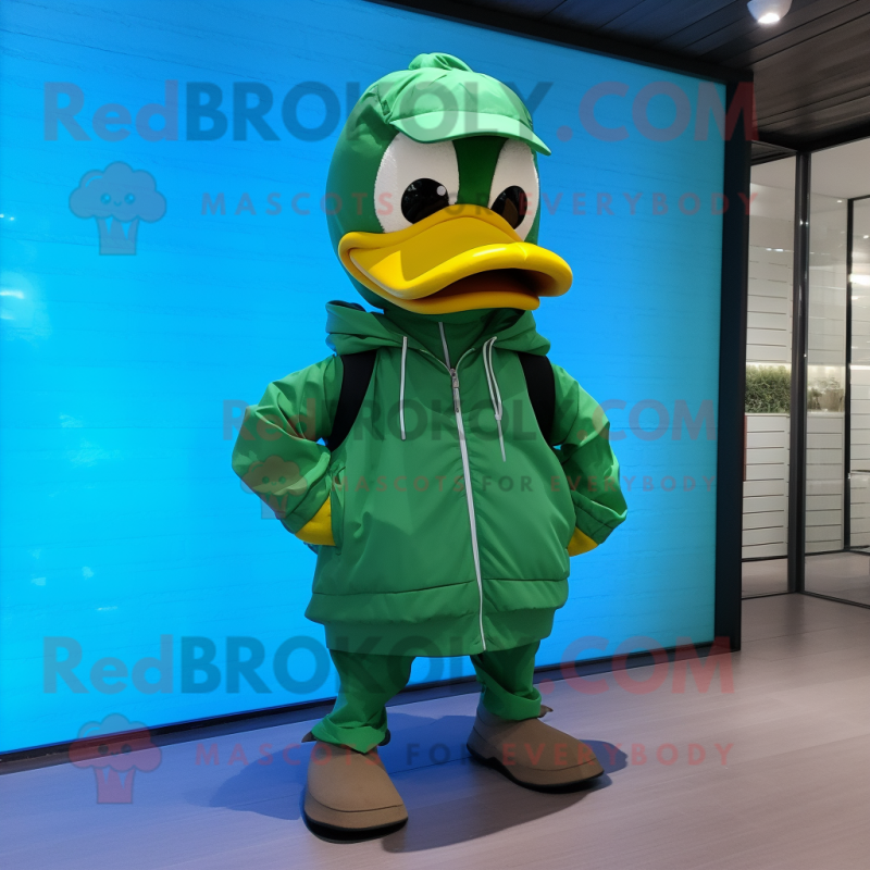 Green Duck mascot costume character dressed with a Windbreaker and Messenger bags