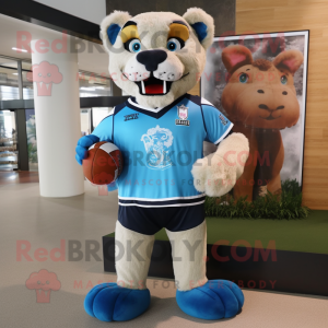 Sky Blue Mountain Lion mascot costume character dressed with a Rugby Shirt and Shoe clips