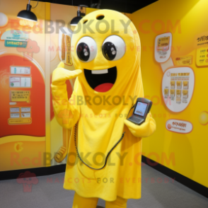 Yellow Phone mascot costume character dressed with a Graphic Tee and Shawls