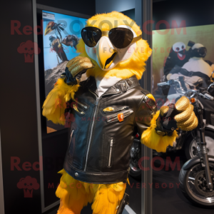 Gold Macaw mascot costume character dressed with a Biker Jacket and Mittens