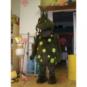 Angstaanjagende bruine en groene monstermascotte -