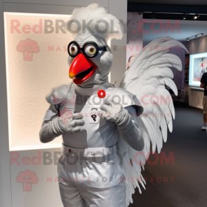 Silver Rooster mascot costume character dressed with a Graphic Tee and Smartwatches