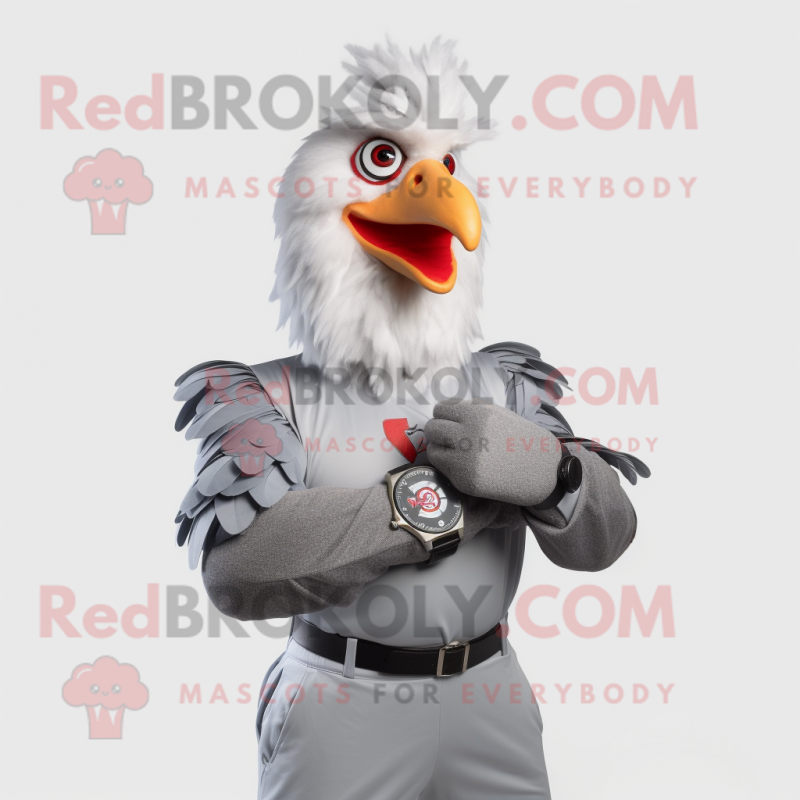 Silver Rooster mascot costume character dressed with a Graphic Tee and Smartwatches