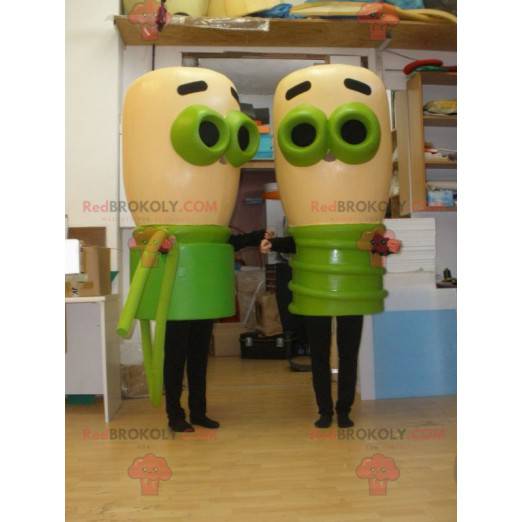 2 mascottes van beige en groene bollen. 2 bollen -