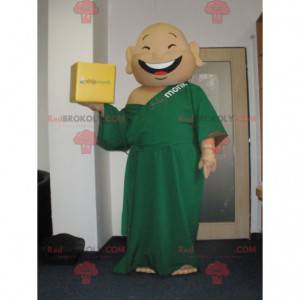 Maskot smějící se mnich oblečený v zelené tunice -