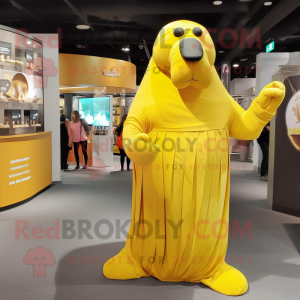 Yellow Walrus mascot costume character dressed with a Empire Waist Dress and Gloves