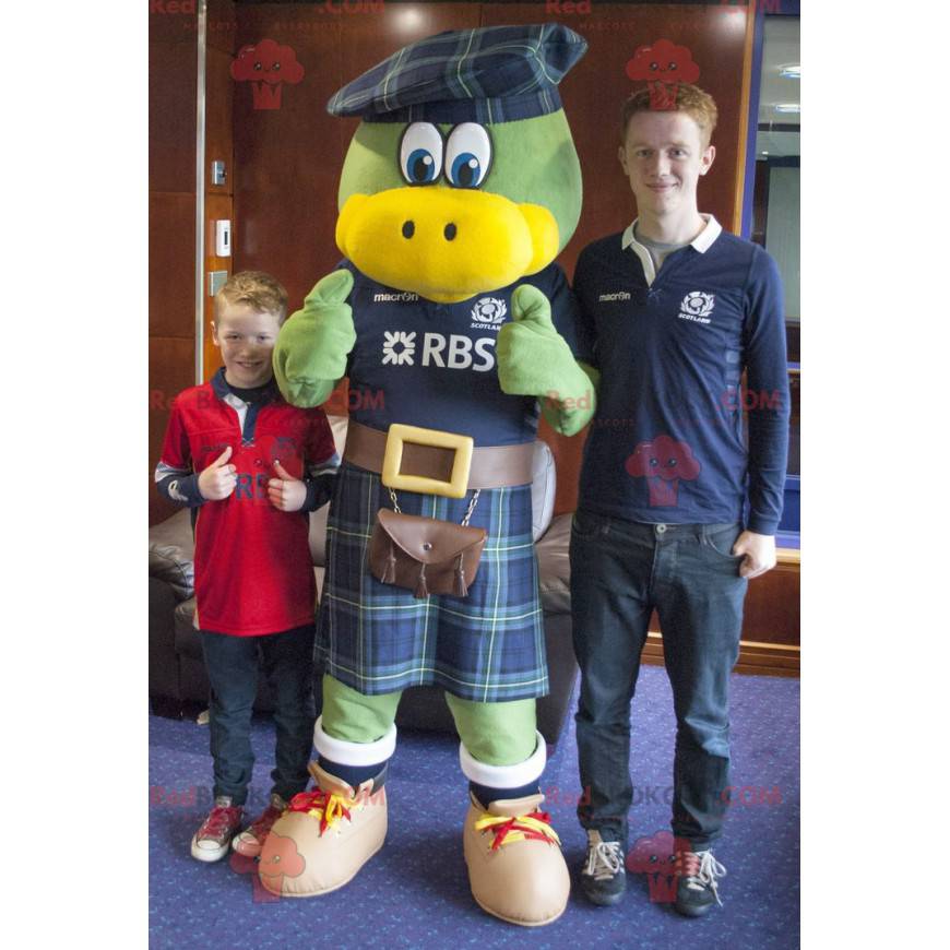 Green and yellow bird mascot dressed in Scottish -