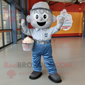 Silver Cupcake mascot costume character dressed with a Denim Shirt and Foot pads