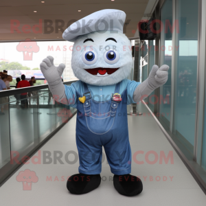 Silver Cupcake mascot costume character dressed with a Denim Shirt and Foot pads