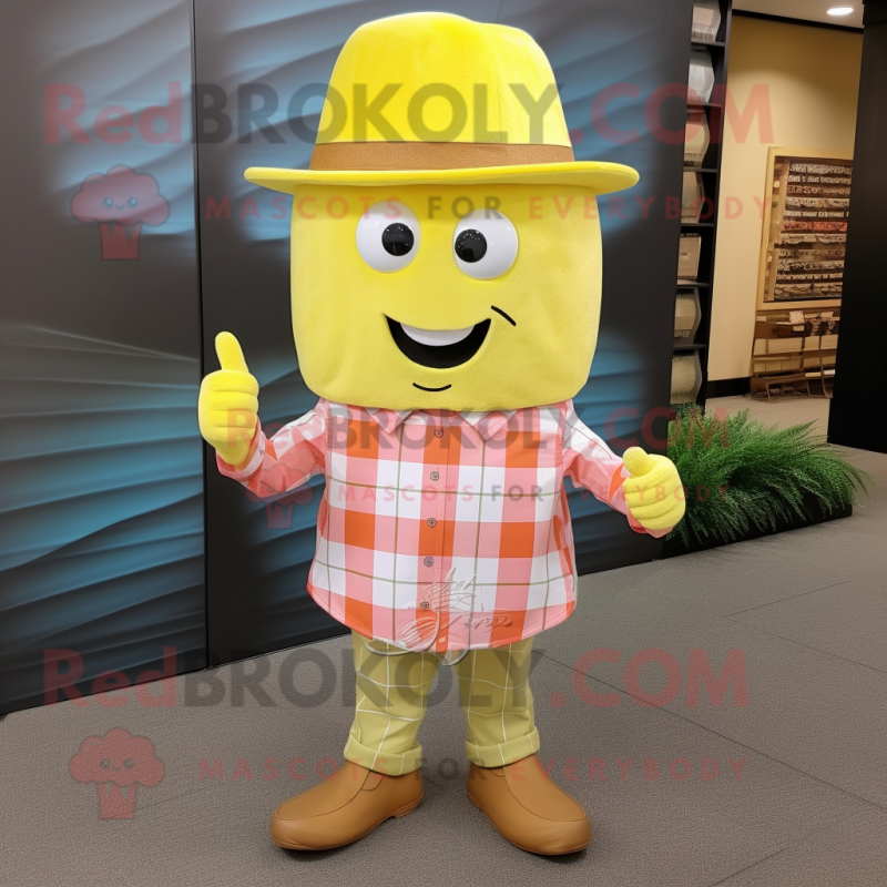 Lemon Yellow Ray mascot costume character dressed with a Flannel Shirt and Hat pins Lemon Yellow Ray mascot costume character dressed with a Flannel Shirt and Hat pins