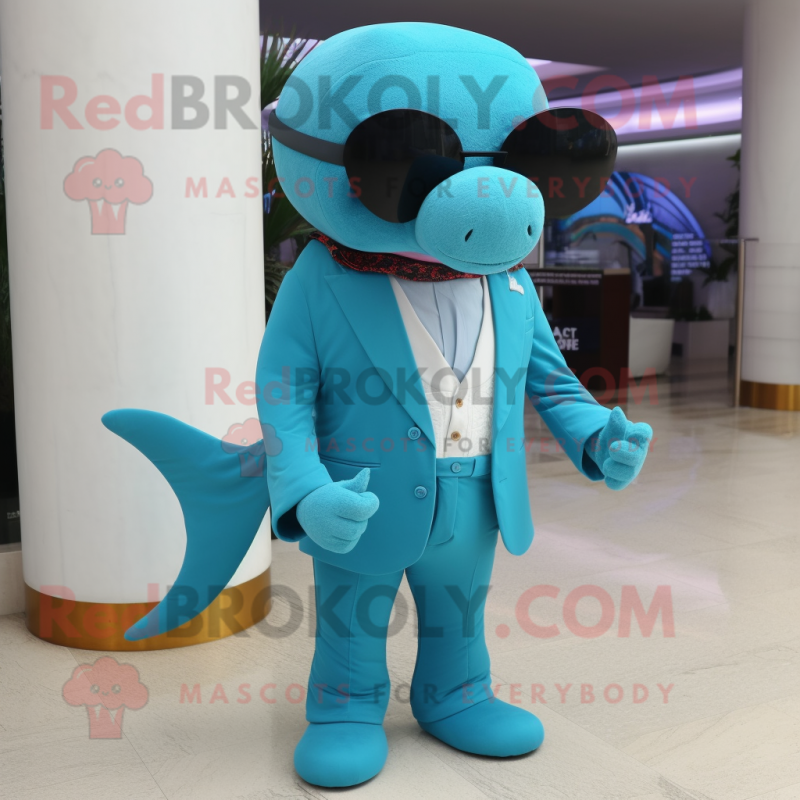 Turquoise Whale mascot costume character dressed with a Suit Pants and Sunglasses