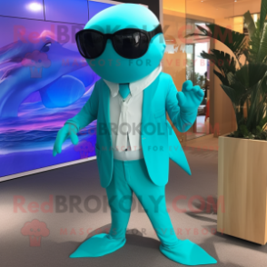 Turquoise Whale mascot costume character dressed with a Suit Pants and Sunglasses