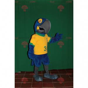 Blauwe en gele papegaai mascotte met een Braziliaanse trui -