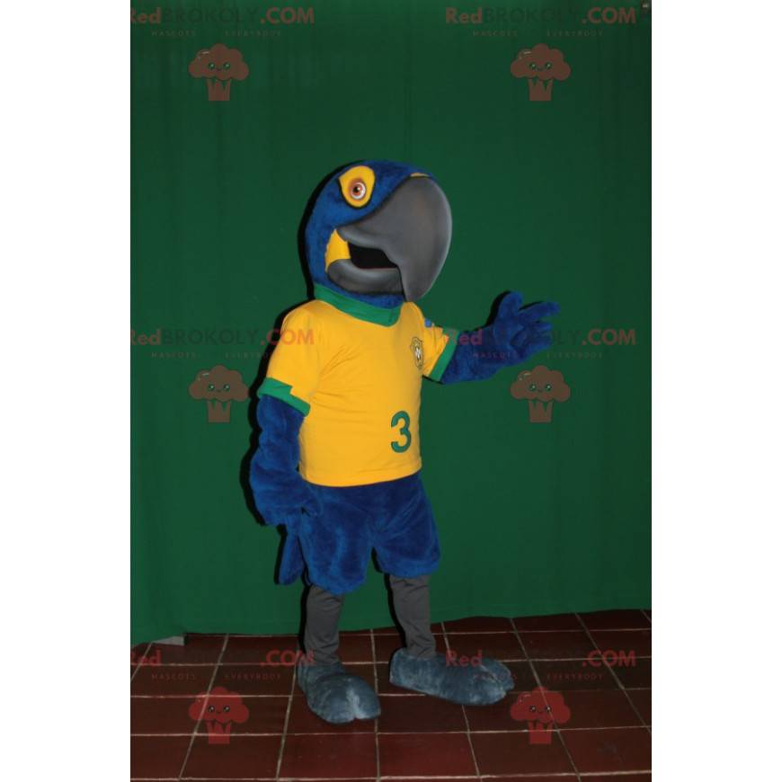 Blauwe en gele papegaai mascotte met een Braziliaanse trui -