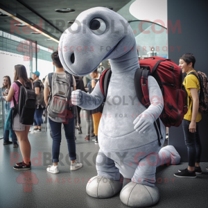 Silver Diplodocus mascot costume character dressed with a Skinny Jeans and Backpacks