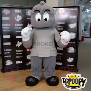 Gray Boxing Glove mascot costume character dressed with a Graphic Tee and Foot pads