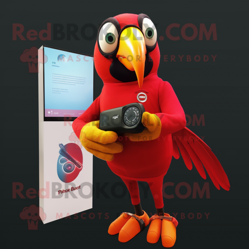 Red Toucan mascot costume character dressed with a Jumpsuit and Smartwatches