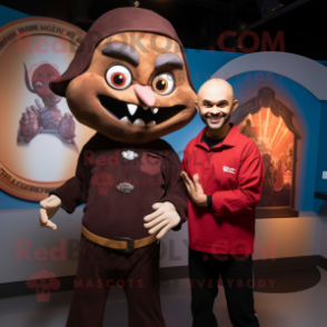 Brown Vampire mascot costume character dressed with a Polo Shirt and Watches