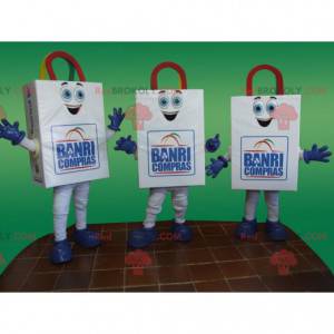 3 mascotte di sacchetti di carta bianchi e sorridenti -