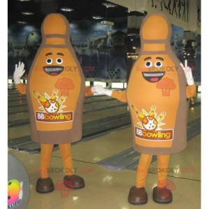 2 mascotes de pinos de boliche marrons e sorridentes -