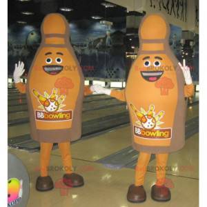 2 mascotte marroni e sorridenti dei birilli da bowling -