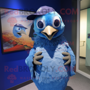Blue Quail mascot costume character dressed with a Cover-up and Caps