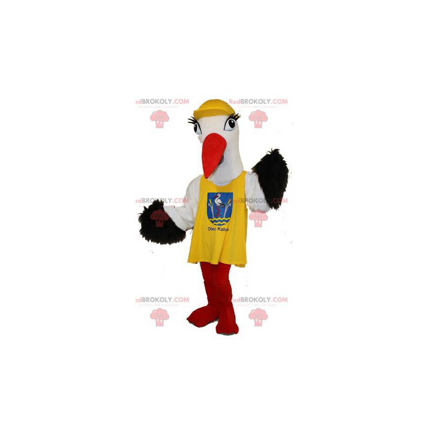 Svart og hvit stork maskot med en gul smekke - Redbrokoly.com