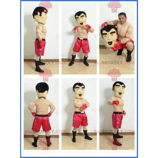 Mascota boxer sin camisa con pantalones cortos rojos -