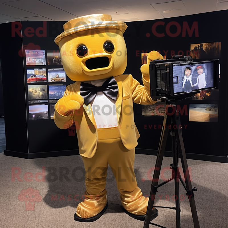 Gold Camera mascot costume character dressed with a Oxford Shirt and Bow ties