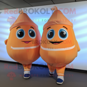 Peach Pair Of Ice Skates mascot costume character dressed with a Jumpsuit and Wraps