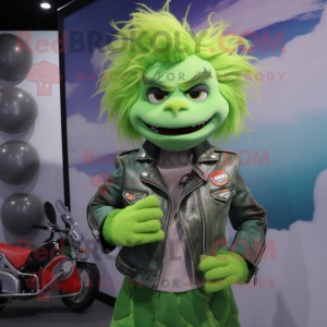 Green Cod mascot costume character dressed with a Moto Jacket and Hair clips