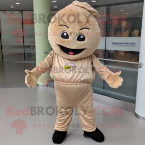 Tan Cupcake mascot costume character dressed with a Joggers and Caps